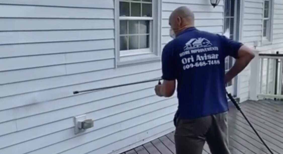 Ori from OriHomeImprovement power washing with precision to restore every surface.
